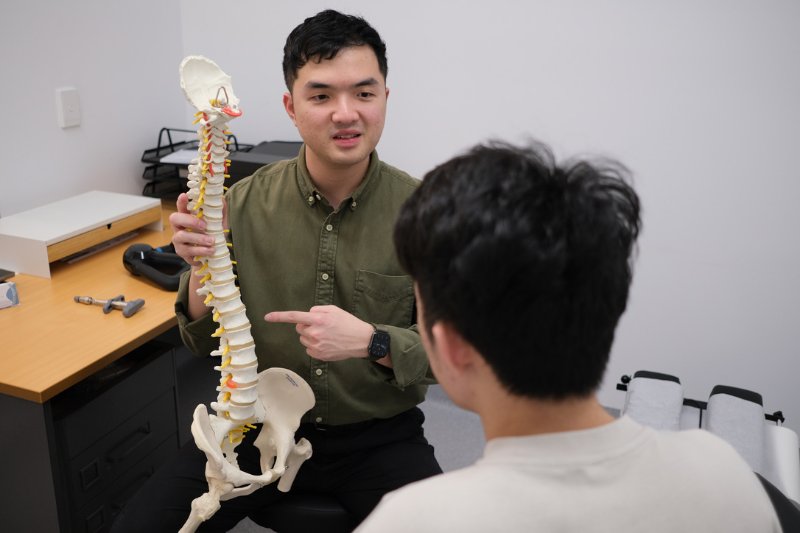 Chiropractor explaining spinal findings to a patient at Langford Chiropractic